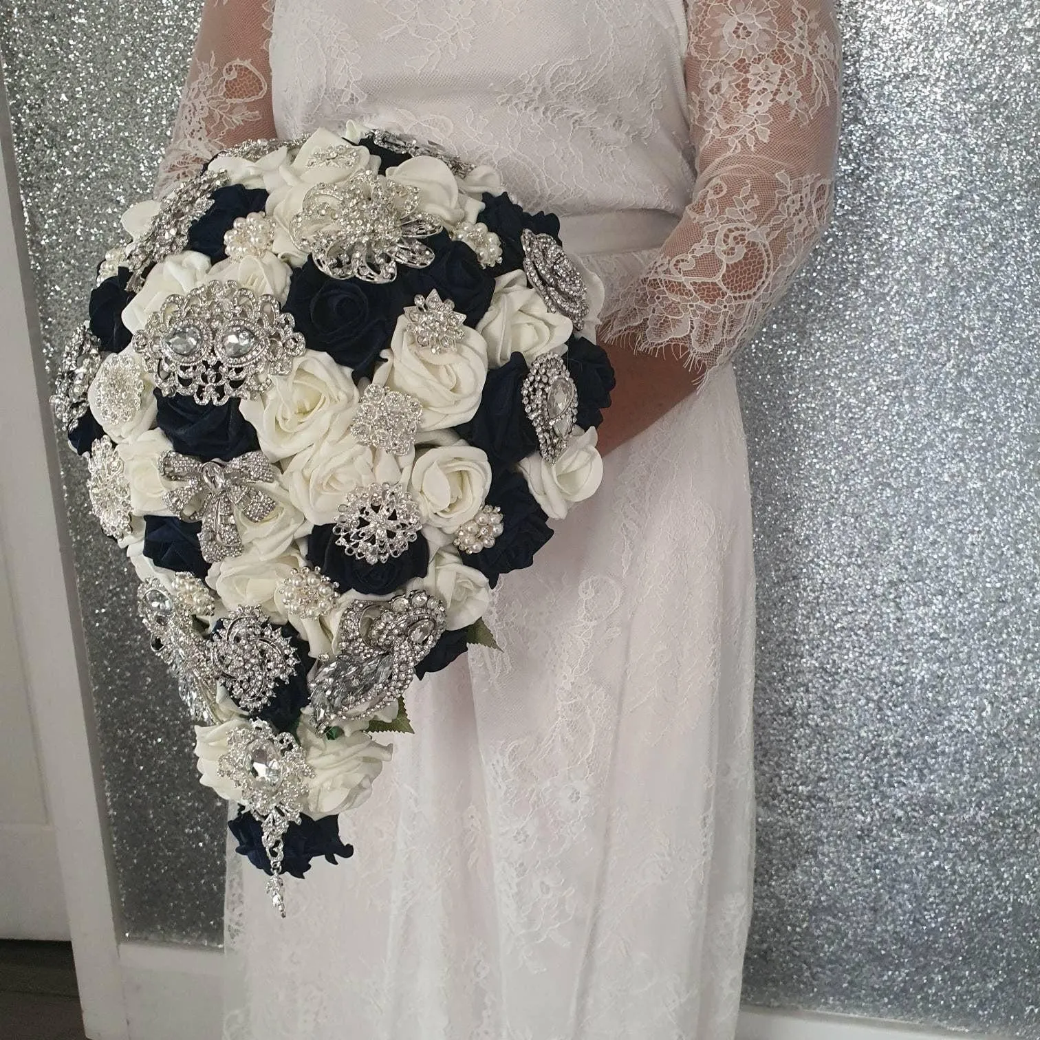 Navy brooch bouquet with artifical foam roses by Crystal wedding uk